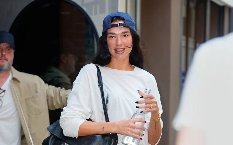 Dua Lipa wearing vacation-inspired studio style in New York City