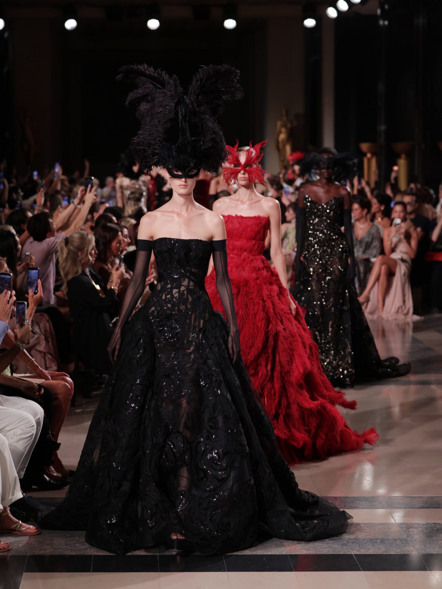 Elie Saab Haute Couture Fall/Winter 2026/2027 runway in Paris with feathered gowns and eveningwear